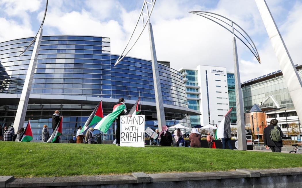 A person climbed onto the roof of the Christchurch City Council during a pro-Palestine protest on 13 May 2024.