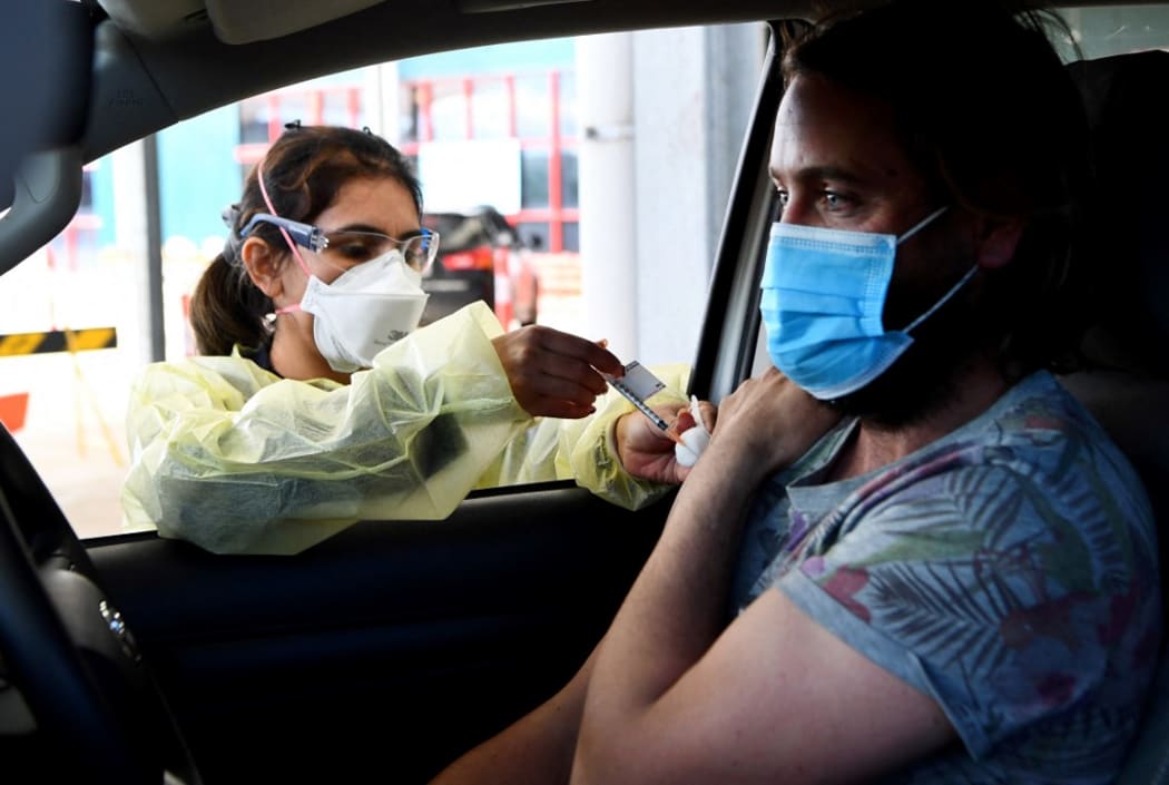 A resident receives a dose of the Pfizer Covid-19 vaccine in the outer Melbourne suburb of Melton on August 10, 2021.