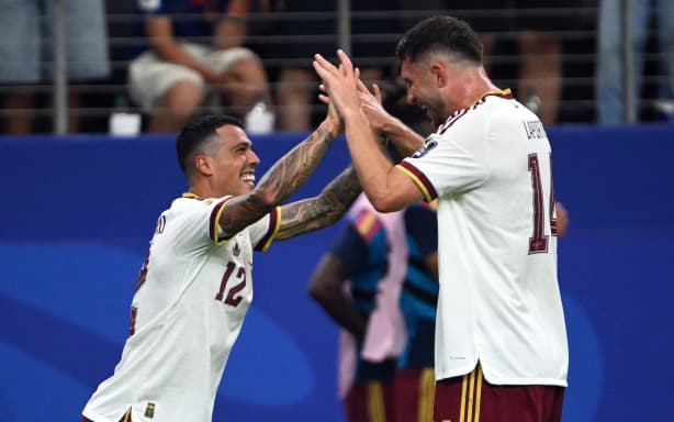 Spain's defender #12 Pedro Porro (L) celebrates with Spain's defender #14 Aymeric Laporte scoring his team's second goal during the 2026 World Cup football tournament semi-final match between France and Spain at the Dallas Stadium in Arlington on July 14, 2026. (Photo by MAURO PIMENTEL / AFP)
