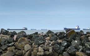 Ships anchored in the Black Sea await to enter the Sulina canal in Romania, one of the places the Danube River joins the Black Sea, on 8 June, 2022.