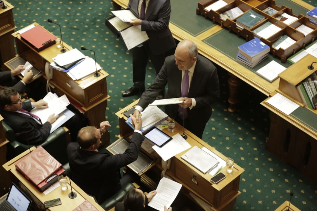 Finance Minister Steven Joyce, delivering his maiden Budget, shakes Labour leader Andrew Little's hand.