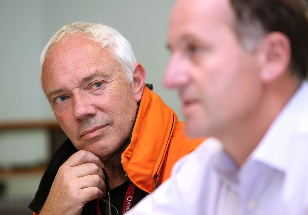 Former Christchurch mayor Bob Parker  listens to Prime Minister John Key during a press conference four days after the deadly quake on February 22, 2011