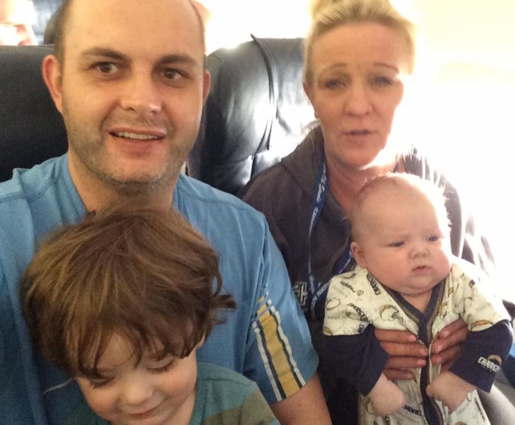New Zealand man Craig Rowland and his wife and small children are in Calgary waiting to hear if their home has burnt to the ground after fleeing a wildfire in Alberta.