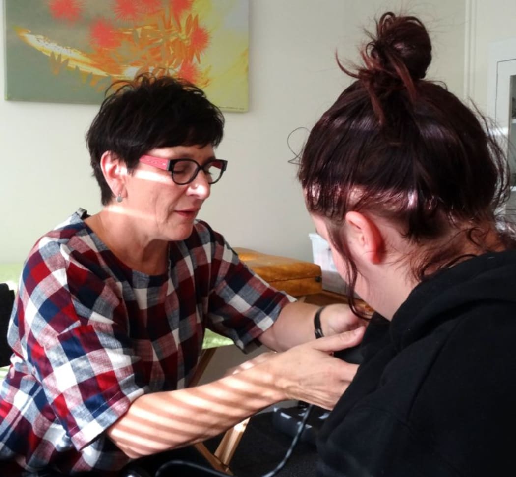 Nurse Practitioner Maria Kekus and client at Pop Up Youth Clinic