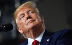 US President Donald Trump speaks during a campaign rally in New Hampshire on 15 August.