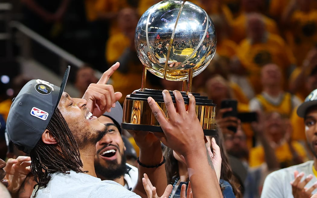 INDIANAPOLIS, INDIANA - MAY 31: Myles Turner #33 of the Indiana Pacers celebrates with the trophy after the 125-108 win against the New York Knicks in Game Six of the Eastern Conference Finals of the 2025 NBA Playoffs at Gainbridge Fieldhouse on May 31, 2025 in Indianapolis, Indiana. NOTE TO USER: User expressly acknowledges and agrees that, by downloading and or using this photograph, User is consenting to the terms and conditions of the Getty Images License Agreement.   Gregory Shamus/Getty Images/AFP (Photo by Gregory Shamus / GETTY IMAGES NORTH AMERICA / Getty Images via AFP)