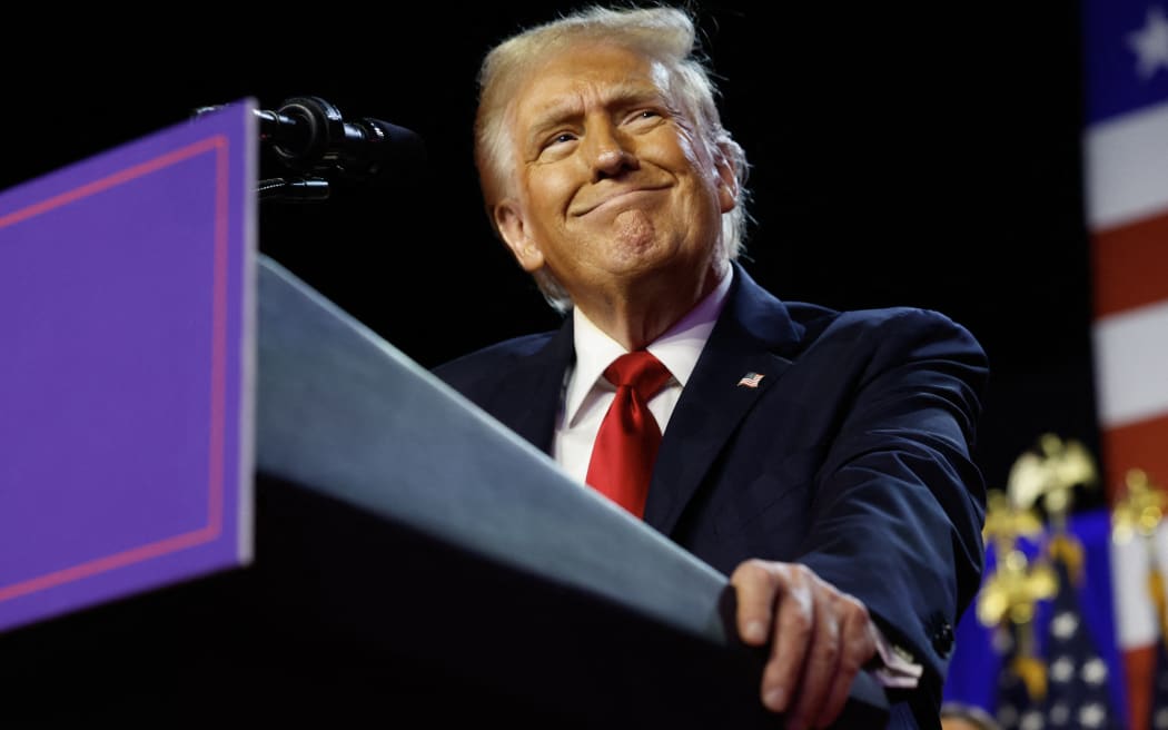 WEST PALM BEACH, FLORIDA - NOVEMBER 06: Republican presidential nominee, former U.S. President Donald Trump arrives to speak during an election night event at the Palm Beach Convention Center on November 06, 2024 in West Palm Beach, Florida. Americans cast their ballots today in the presidential race between Republican nominee former President Donald Trump and Vice President Kamala Harris, as well as multiple state elections that will determine the balance of power in Congress.   Chip Somodevilla/Getty Images/AFP (Photo by CHIP SOMODEVILLA / GETTY IMAGES NORTH AMERICA / Getty Images via AFP)