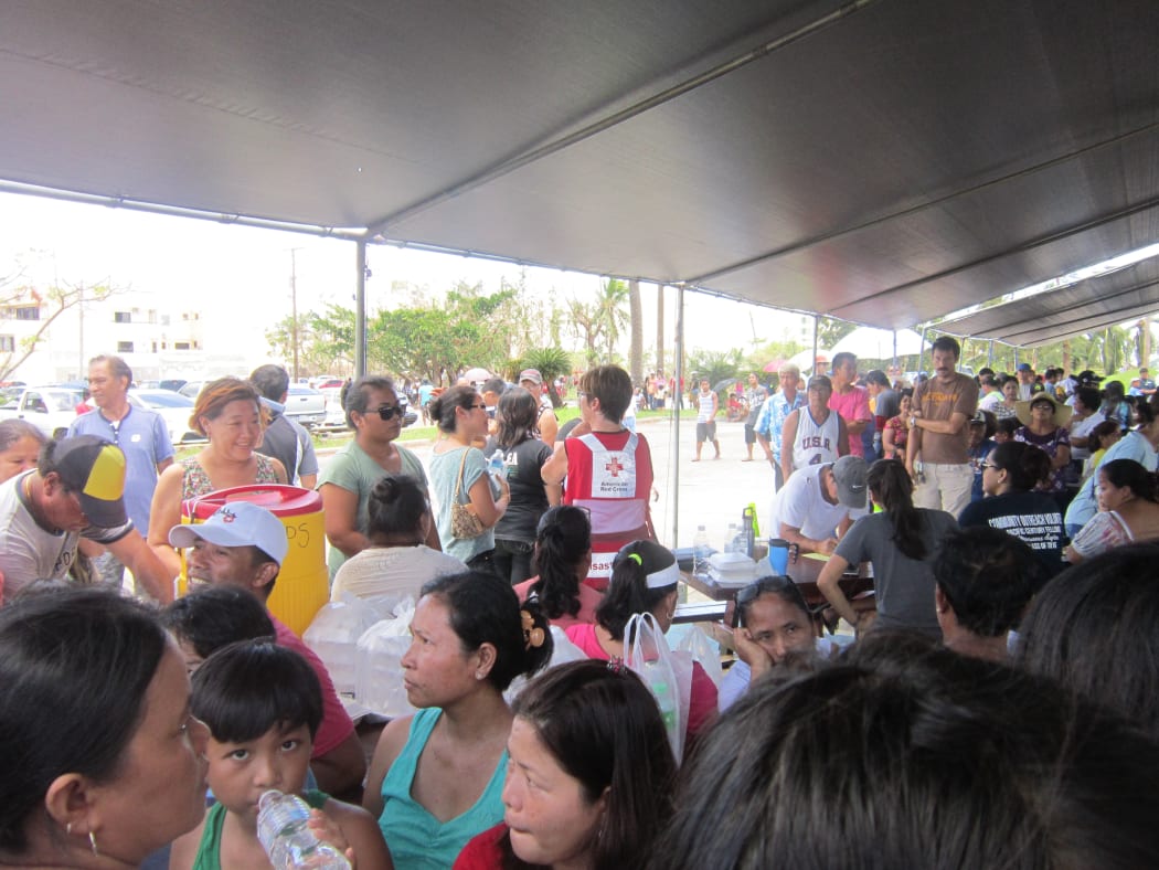Saipan residents queue for post-typhoon aid at the American Memorial Park, Northern Marianas.