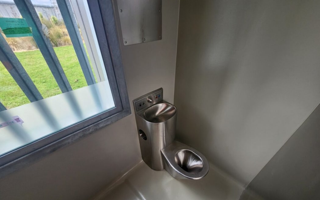 A toilet inside one of the cells.