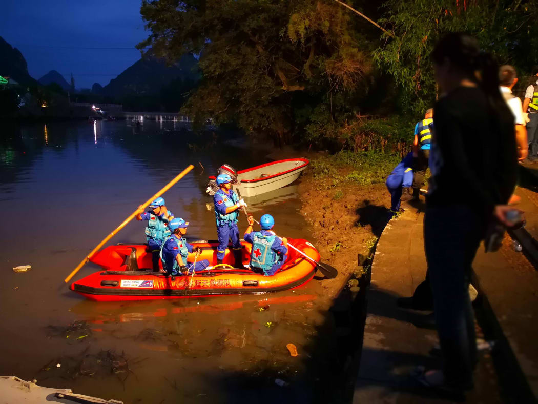 Rescuers patrol to look for missing people after two boats capsized in Guilin in Southern China, on April 21, 2018.
According to the latest report from the Guangxi Daily, 40 people were rescued, 11 people were killed and 6 were missing. / AFP PHOTO / STR / China OUT