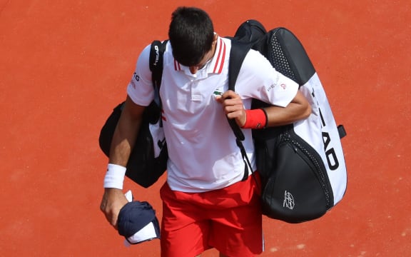 Serbia's Novak Djokovic leaves the court after his defeat in his third round singles match against Britain's Daniel Evans on day six of the Monte-Carlo ATP Masters Series tournament in Monaco on April 15, 2021.