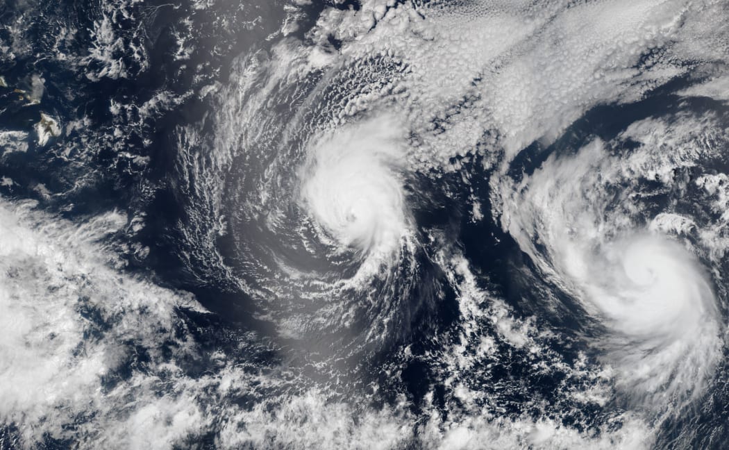 NASA Rarth Observatory image shows on August 5, both Iselle (L) and Hurricane Julio (R) en route to Hawaii.