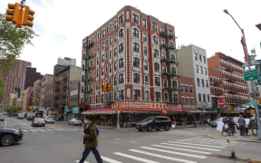 A woman crosses the street in Chinatown
on Manhattan Island in New York City in the United States. New York City is the epicenter of the Coronavirus pandemic (COVID-19). (Photo by William Volcov / BRAZIL PHOTO PRESS / Brazil Photo Press via AFP)
