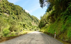 Lonely scenic highway through farmland in Taranaki, New Zealand