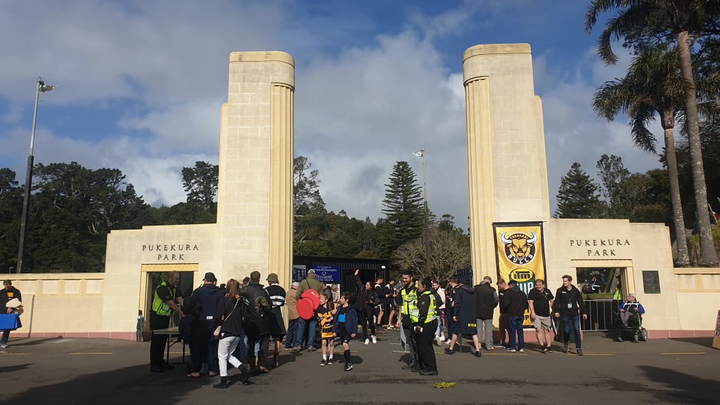 Fans stream through the gates into Pukekura Park.