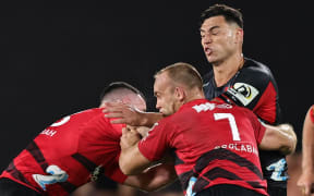 Tom Christie of the Crusaders tackles Shaun Stevenson of the Chiefs during the Super Rugby Pacific rugby match between the Chiefs and the Crusaders at FMG Stadium in Hamilton, New Zealand on Friday February 23, 2024. Copyright photo: Aaron Gillions / www.photosport.nz