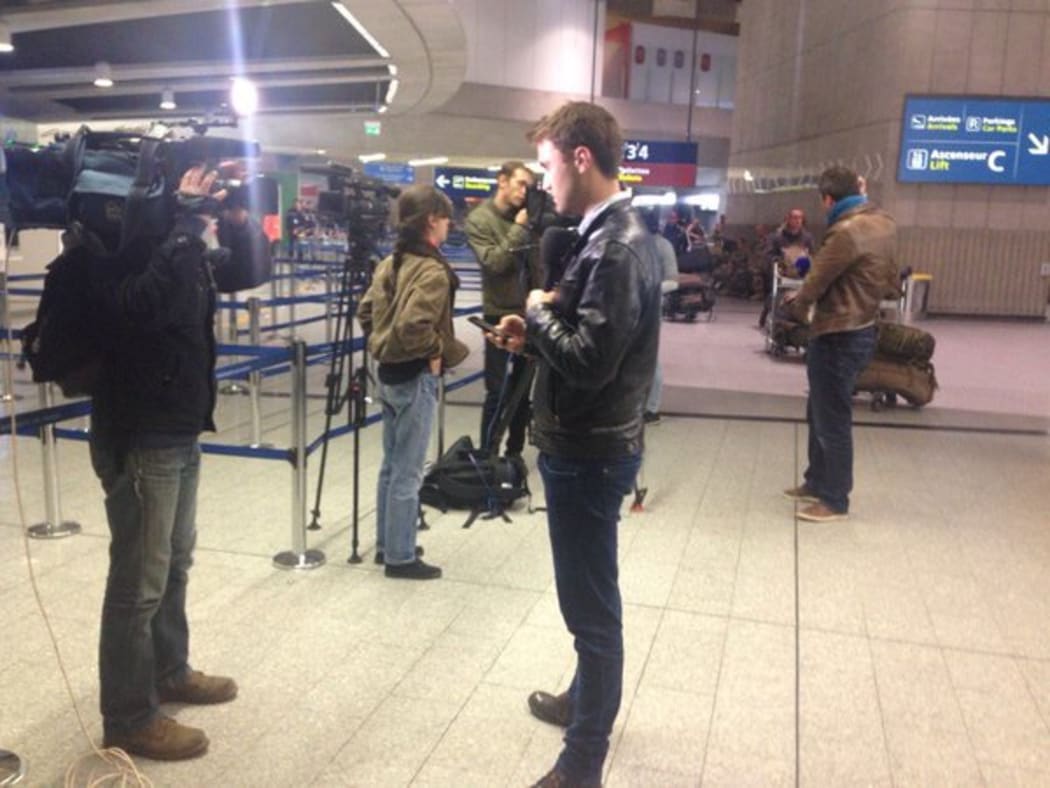 Reporters in front of EgyptAir at Charles de Gaulle airport in Paris.