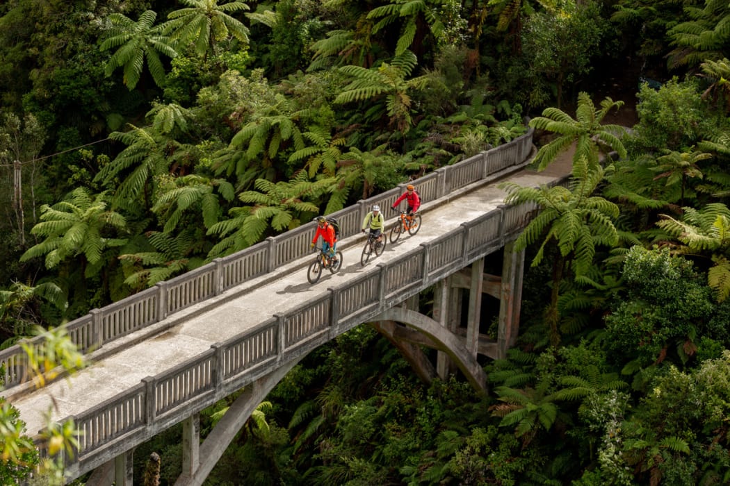 Cyclists on the Mountains to Sea - Ngā Ara Tūhono Great Ride, crossing the Bridge To Nowhere.