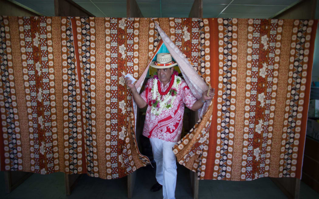 Tapura Huiraatira leader Edouard Fritch emerges after casting his ballot in the second round of French Polynesia's territorial election. The Tapuraa won a resounding victory, it was announced last night.