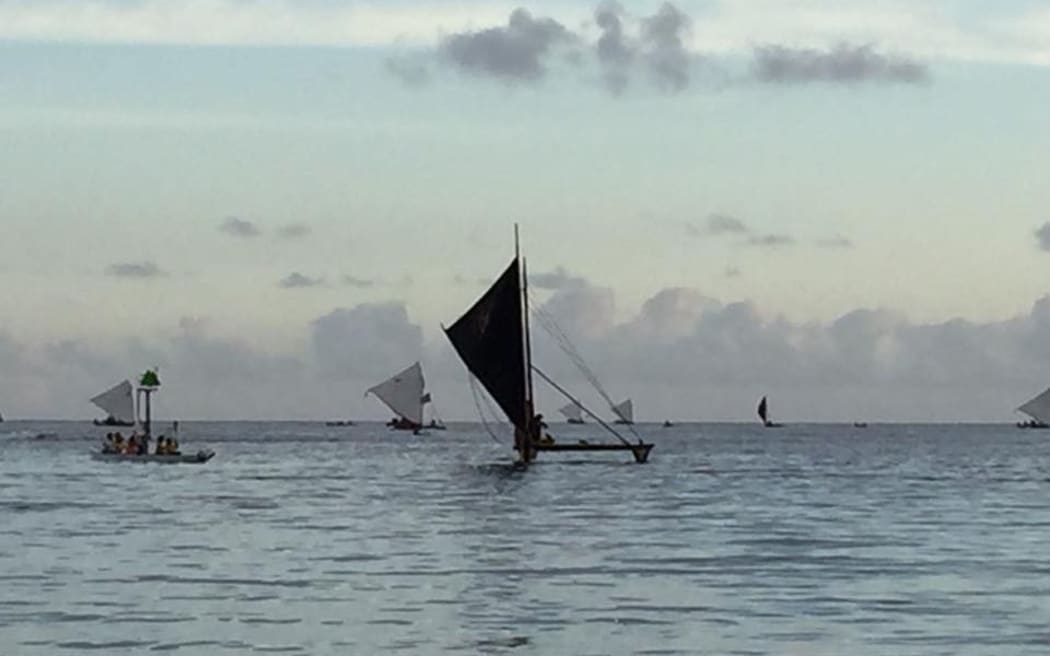 A series of canoes arrive in Guam for the opening day of the Festival of the Pacific Arts.
