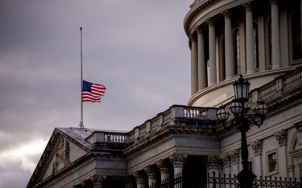 A flag is lowered to half-staff for the death of former U.S. President Jimmy Carter at the U.S. Capitol Building on January 2, 2025 in Washington, DC. Congress returns tomorrow for a busy month including the January 6th, 2025 vote count to certify the election, Inauguration Day, and a ceremony for Carter who will lie in state in the U.S. Capitol's rotunda.   Andrew Harnik/Getty Images/AFP (Photo by Andrew Harnik / GETTY IMAGES NORTH AMERICA / Getty Images via AFP)