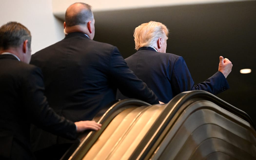 NEW YORK, NEW YORK - SEPTEMBER 23: U.S. President Donald Trump (R) gestures after walking up an escalator as he arrives to the 80th session of the UN’s General Assembly (UNGA) at the United Nations headquarters on September 23, 2025 in New York City. World leaders convened for the 80th Session of UNGA, with this year’s theme for the annual global meeting being “Better together: 80 years and more for peace, development and human rights.”