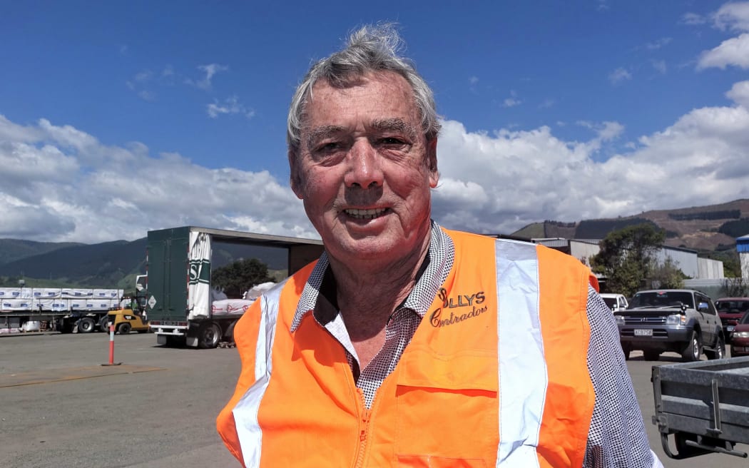 man in hi viz orange vest