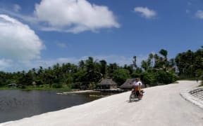 Scooter at shoreline Kiribati