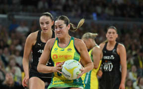 Sophie Garbin of Australia (centre) catches the ball during the first test match of the Constellation Cup series between the Australian Diamonds and the New Zealand Silver Ferns at John Cain Arena in Melbourne, Friday, October 17, 2025. (AAP Image/James Ross/Photosport) NO ARCHIVING, EDITORIAL USE ONLY