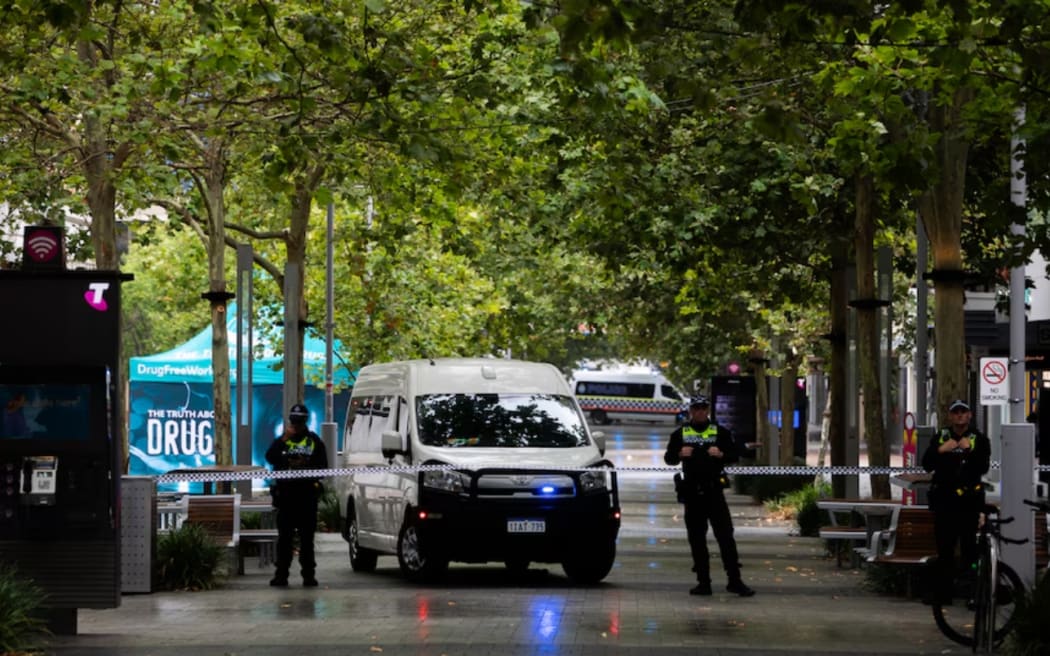 WA Police officers block access to the Murray Street Mall after a bomb scare at an Invasion Day rally.