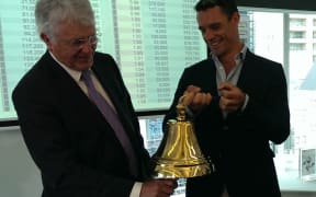 Arvida, chair, Peter Wilson is the first to ring NZX’s new bell, held by shareholder and All Black Dan Carter.