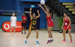 Action from the Tonga (red) and Papua New Guinea game in Suva