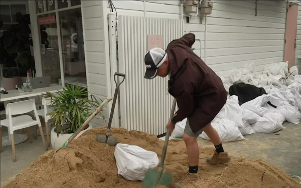 On 5 March, 2025, Tim Fowler says he's had a few tonnes of sand delivered as he prepares his Brisbane cafe for possible flooding, during Tropical Cyclone Alfred.