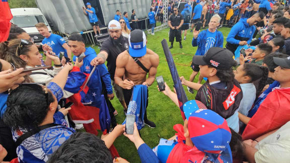 Toa Samoa fans surround their sporting heroes