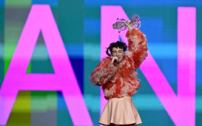 Swiss singer Nemo representing Switzerland with the song "The Code" raises the trophy after winning the final of the 68th Eurovision Song Contest (ESC) 2024 on May 11, 2024 at the Malmo Arena in Malmo, Sweden.