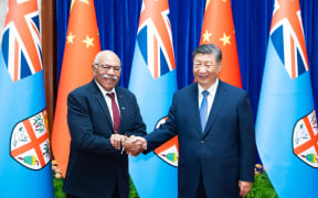 Rabuka, left, andPresident Xi.