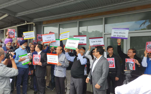 Protesters demanding better security for dairy and retail worker gather outside Prime Minister Jacinda Ardern's electorate office in Mt Albert, Auckland, following the fatal stabbing at a Sandringham dairy.