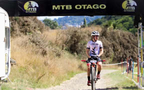 Anton Cooper successfully defended his cross-country honours at the UCI Altherm Oceania Mountain Bike Championships in Dunedin.