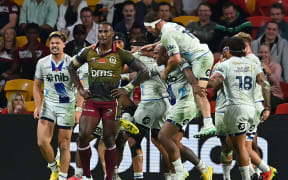 The Blues celebrate the match winning try scored by Sam Nock during the round 10 Super Rugby Pacific match between Queensland Reds and Blues.