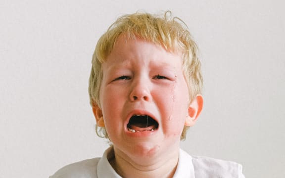 blonde boy crying