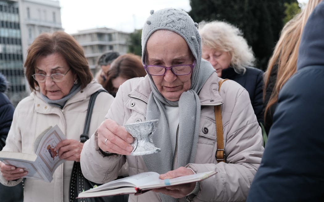 Protesters demonstrate against same-sex marriage and adoption in Athens, Greece, on February 15, 2024. (Photo by Nikolas Kokovlis / NurPhoto / NurPhoto via AFP)