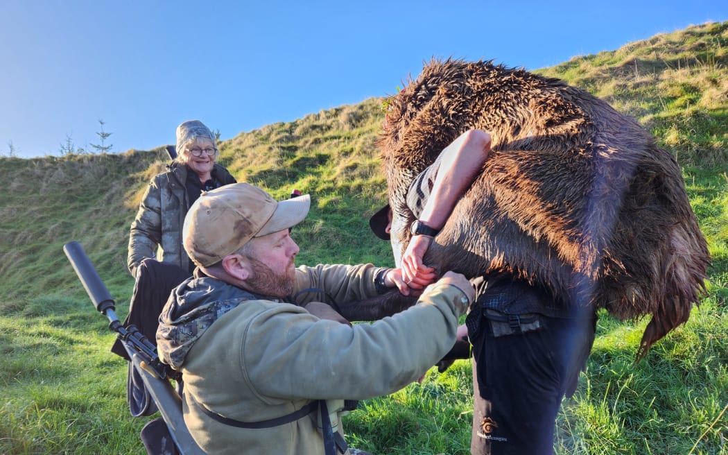 Matt helps Sam load up the kill for the trek out