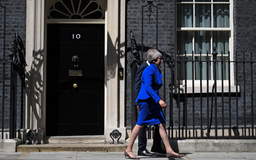 Britain's outgoing prime minister Theresa May ,accompanied by her husband Philip, leaves after making a speech outside 10 Downing street in London on July 24, 2019, on her way to formally tender her resignation at Buckingham Palace.