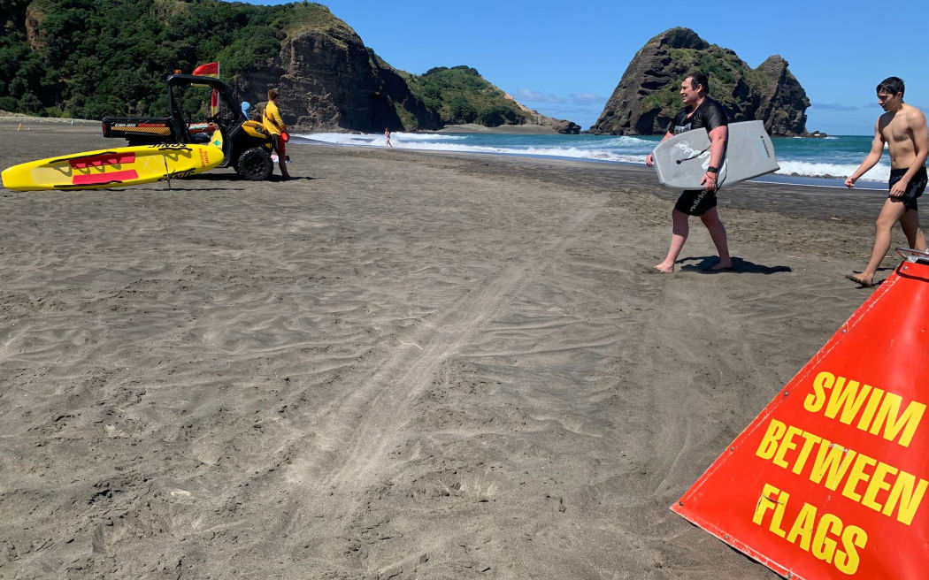Surf lifesavers at Piha Beach