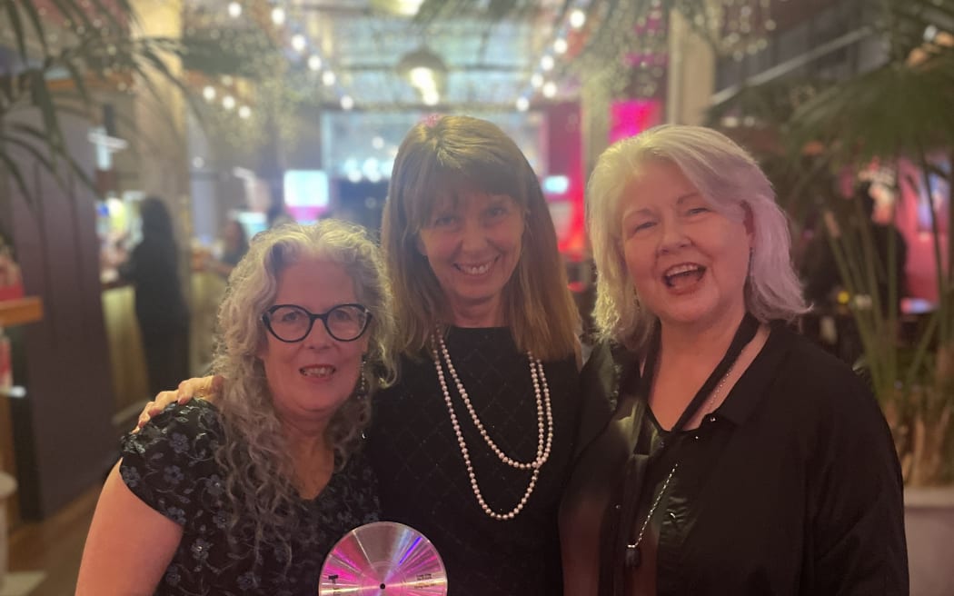 Members of Look Blue Go Purple celebrate their IMNZ Classic Record honour.