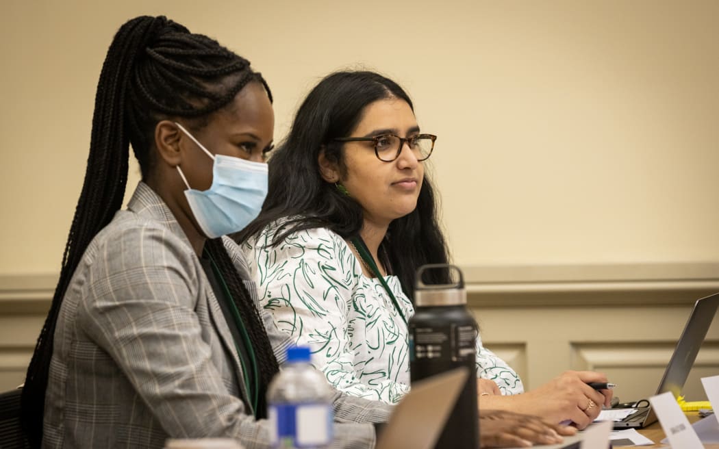 Youth MP's Sarah-Joy Aruwa and Sumita Singh listen to evidence in a select committee hearing.