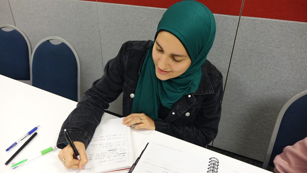 Young woman in green headscarf