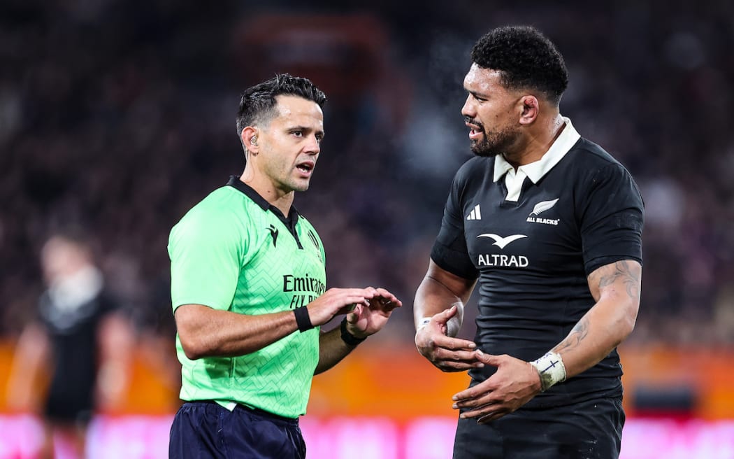 Ardie Savea discusses a try that was later disallowed with referee Nic Berry.