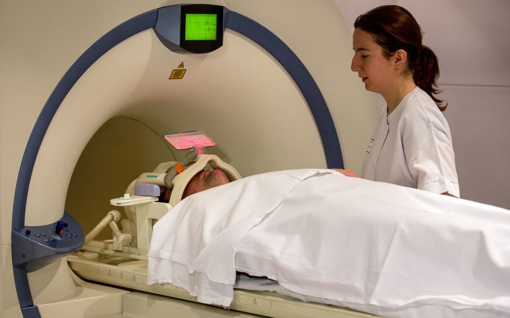 A nurse practices a magnetic resonance imaging (MRI) exam on a patient.