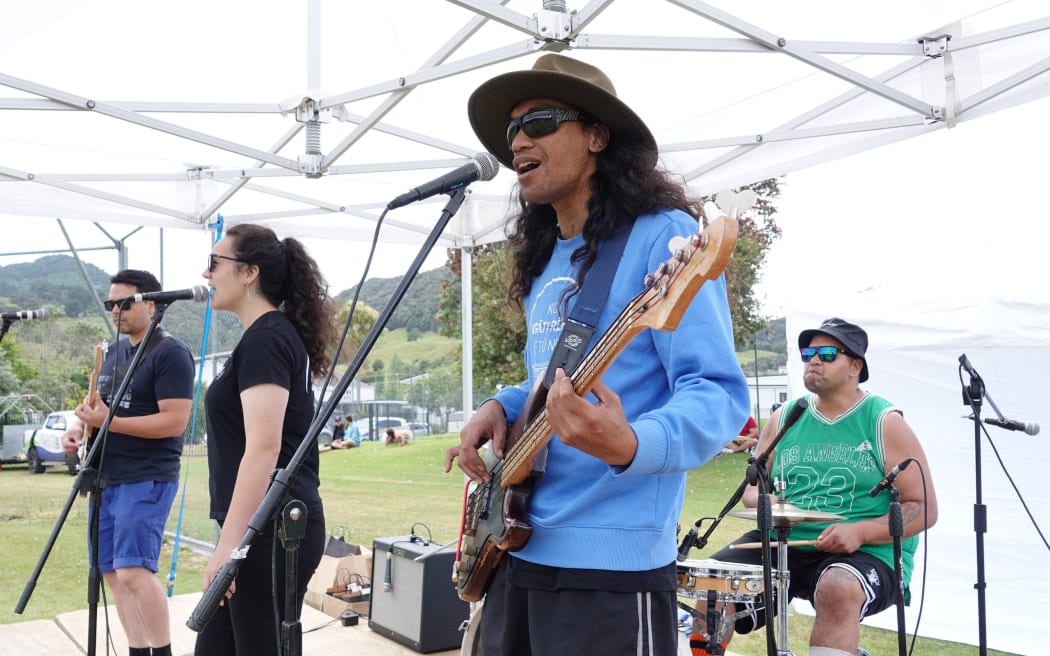 Covers band Kōhia, with Harry Muunu on bass, keeps the crowd entertained.